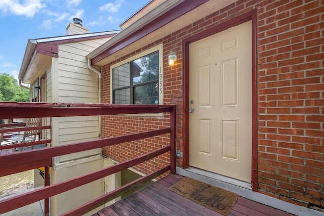 1355 Warrior Way Unit 67, Tallahassee, FL 32304 - property entrance featuring brick siding and a chimney