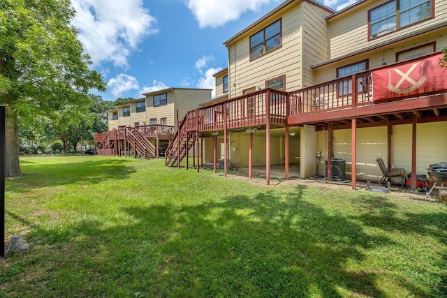 1355 Warrior Way Unit 67, Tallahassee, FL 32304 - rear view of house with central AC, a deck, stairs, and a lawn