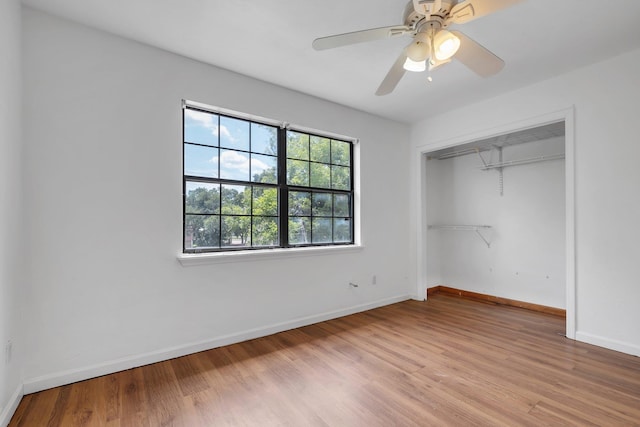 1355 Warrior Way Unit 67, Tallahassee, FL 32304 - unfurnished bedroom featuring light wood finished floors, baseboards, a closet, and a ceiling fan
