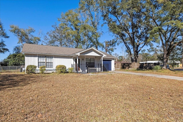 single story home featuring central AC unit, a garage, and a front lawn