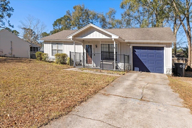 ranch-style house with a porch, a garage, and a front yard