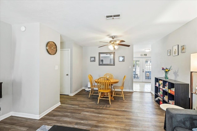 dining room featuring french doors, dark hardwood / wood-style flooring, and ceiling fan