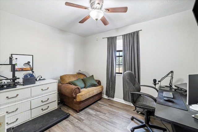 office space with light wood-type flooring and ceiling fan