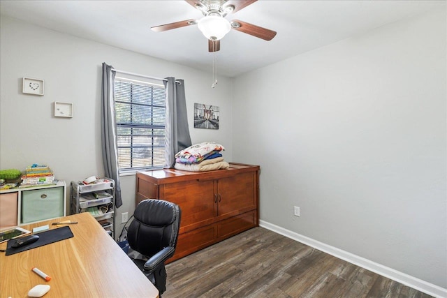 office with dark hardwood / wood-style floors and ceiling fan