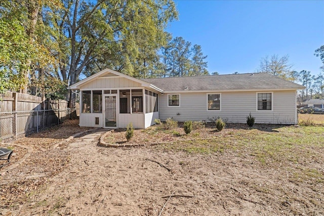 back of house with a sunroom