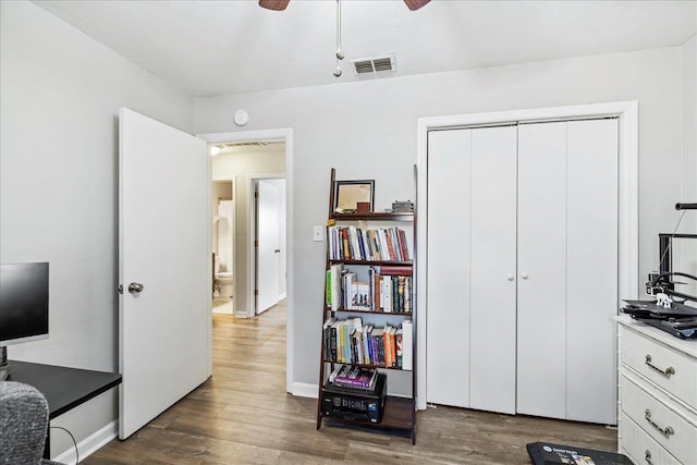 office area featuring ceiling fan and dark hardwood / wood-style flooring