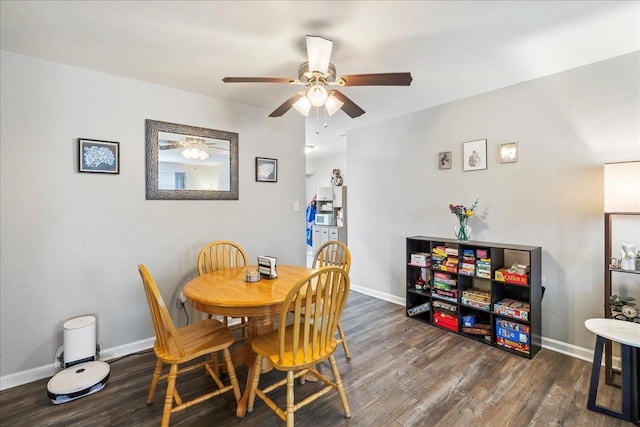 dining area with dark hardwood / wood-style flooring and ceiling fan