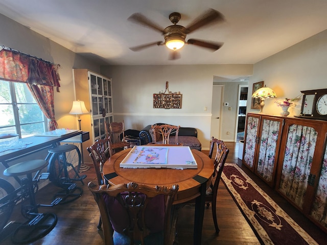 dining room featuring dark hardwood / wood-style floors and ceiling fan