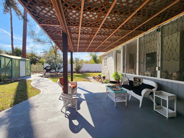 view of patio / terrace with a shed