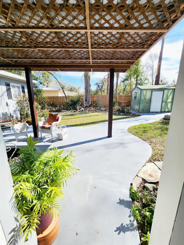 view of patio / terrace featuring a storage unit