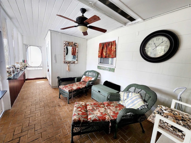 living room featuring wood ceiling and ceiling fan