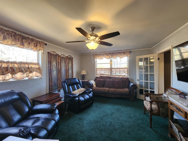 living room with ceiling fan, ornamental molding, and carpet floors