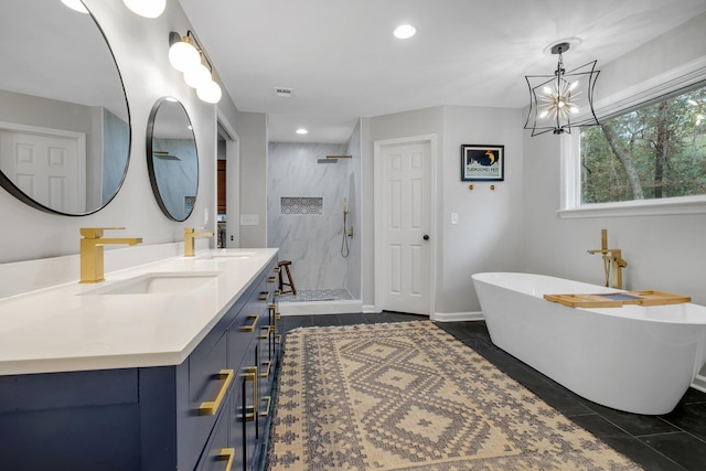 bathroom featuring visible vents, a stall shower, vanity, tile patterned flooring, and a freestanding tub