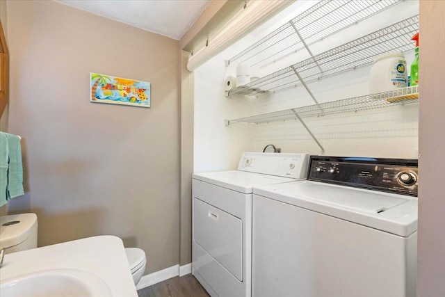 17 Harbour Point Dr, Crawfordville, FL 32327 - laundry room with washing machine and clothes dryer and dark wood-style flooring