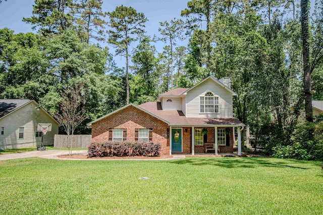 1682 Copperfield Cir, Tallahassee, FL 32312 - traditional-style home with brick siding, a chimney, and a porch