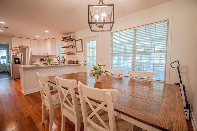 1682 Copperfield Cir, Tallahassee, FL 32312 - dining space featuring healthy amount of natural light, a chandelier, dark wood-type flooring, and recessed lighting