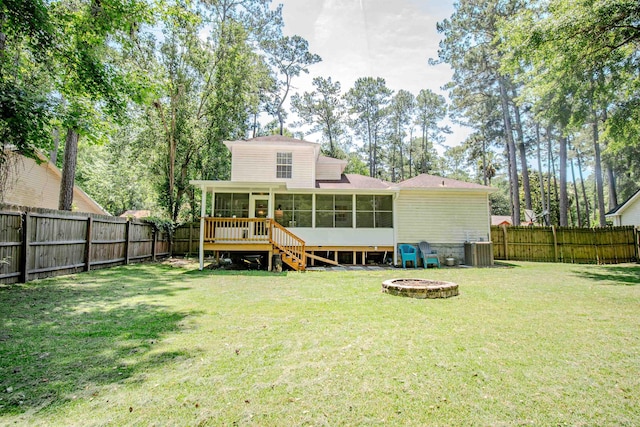 1682 Copperfield Cir, Tallahassee, FL 32312 - rear view of property featuring a sunroom, a fire pit, a fenced backyard, and stairway