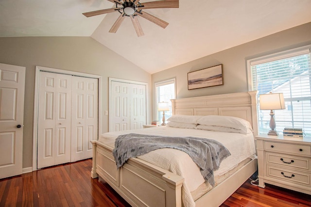 1682 Copperfield Cir, Tallahassee, FL 32312 - bedroom featuring two closets, vaulted ceiling, dark wood-style flooring, and ceiling fan