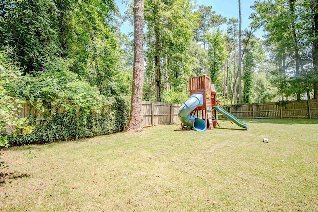 1682 Copperfield Cir, Tallahassee, FL 32312 - fenced backyard featuring a playground