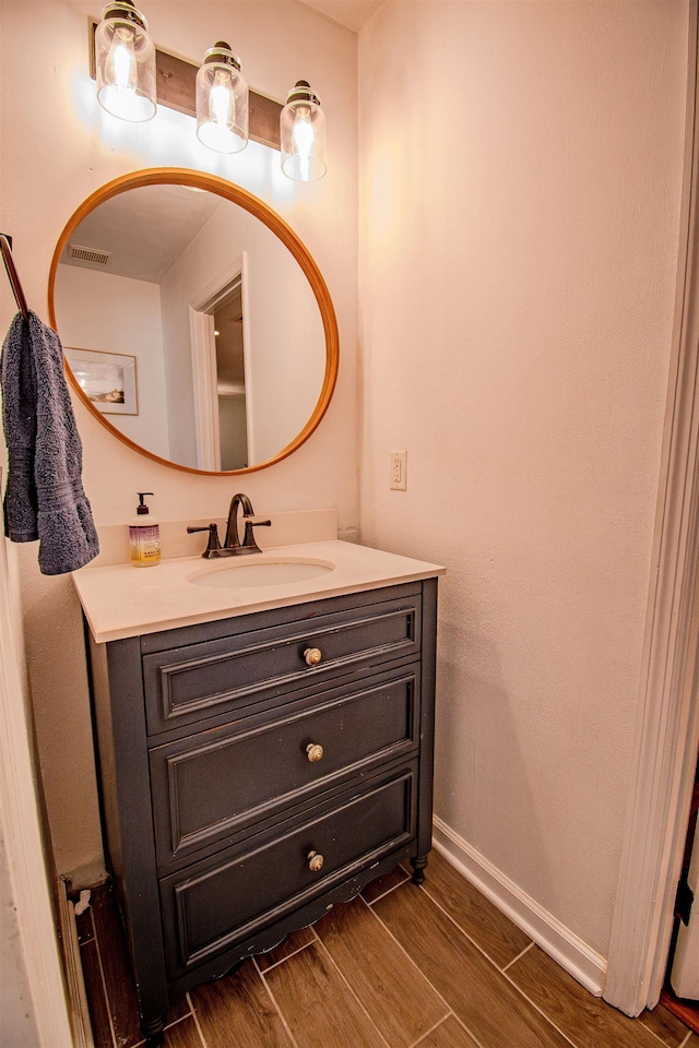 1682 Copperfield Cir, Tallahassee, FL 32312 - bathroom featuring vanity and wood finished floors