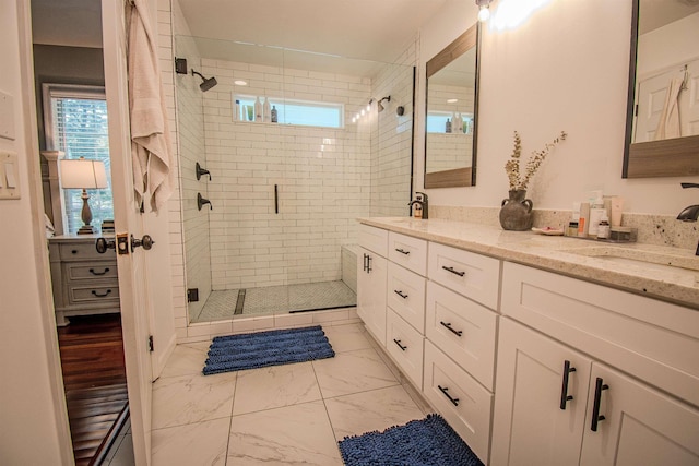 1682 Copperfield Cir, Tallahassee, FL 32312 - bathroom with double vanity, marble finish flooring, a shower stall, and plenty of natural light