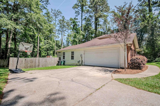 1682 Copperfield Cir, Tallahassee, FL 32312 - view of side of property featuring driveway and an attached garage