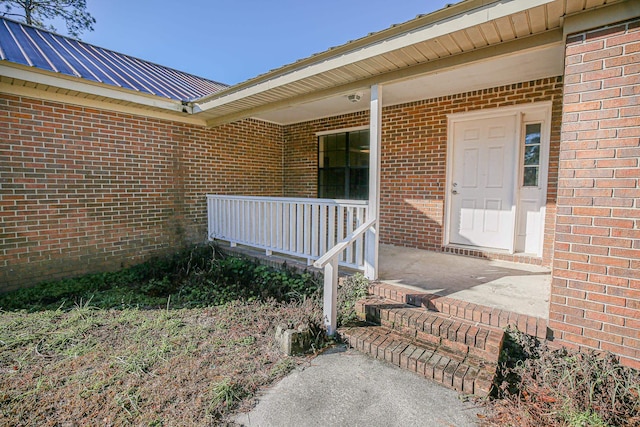 doorway to property featuring a porch