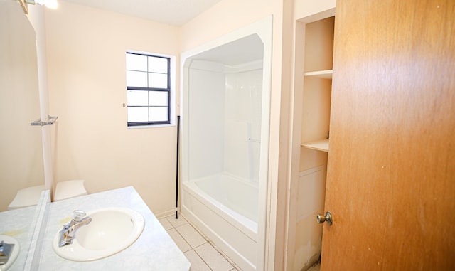 bathroom featuring vanity, tile patterned floors, and shower / bath combination