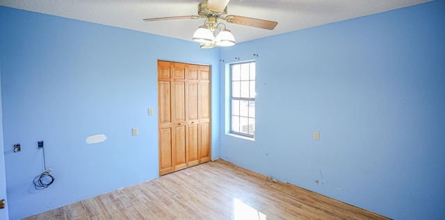 spare room with ceiling fan and light hardwood / wood-style flooring