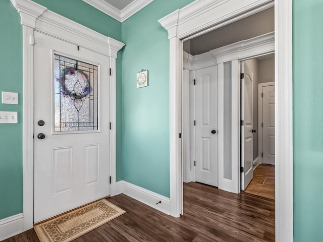 entrance foyer with dark wood-style floors, baseboards, and crown molding