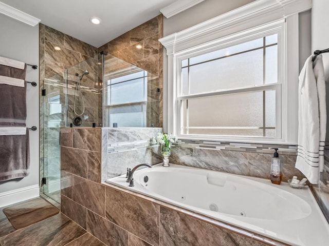 full bath with a tub with jets, ornamental molding, and a shower stall