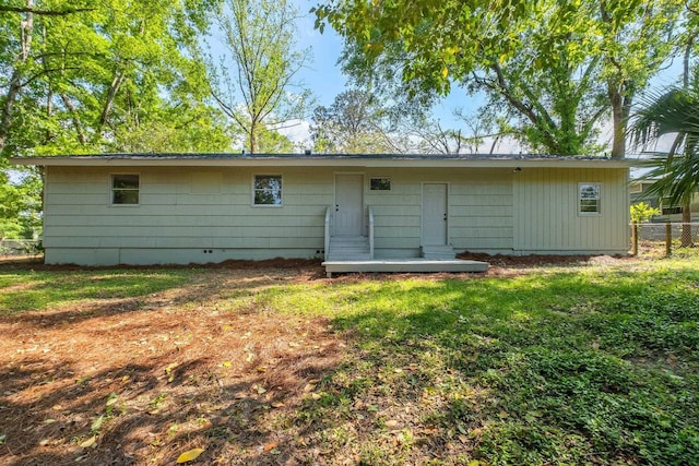 2212 Berkshire Dr, Tallahassee, FL 32304 - rear view of house with a yard, fence, and crawl space
