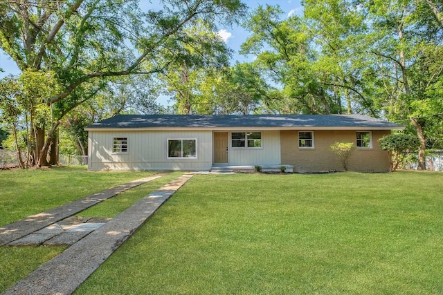 2212 Berkshire Dr, Tallahassee, FL 32304 - back of house featuring a yard and fence