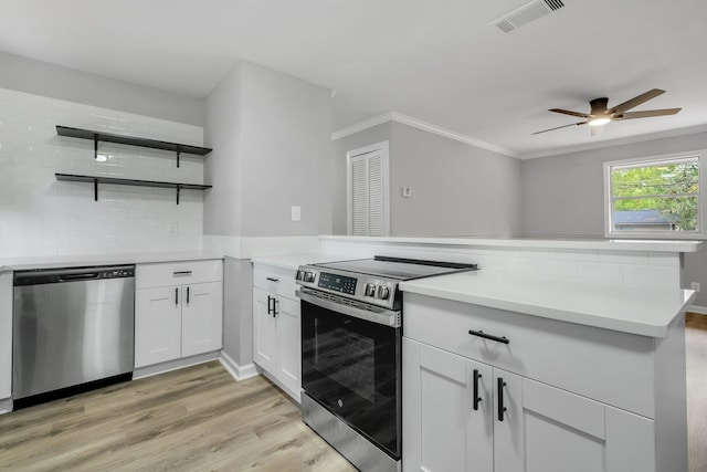 2212 Berkshire Dr, Tallahassee, FL 32304 - kitchen featuring visible vents, appliances with stainless steel finishes, a ceiling fan, a peninsula, and backsplash