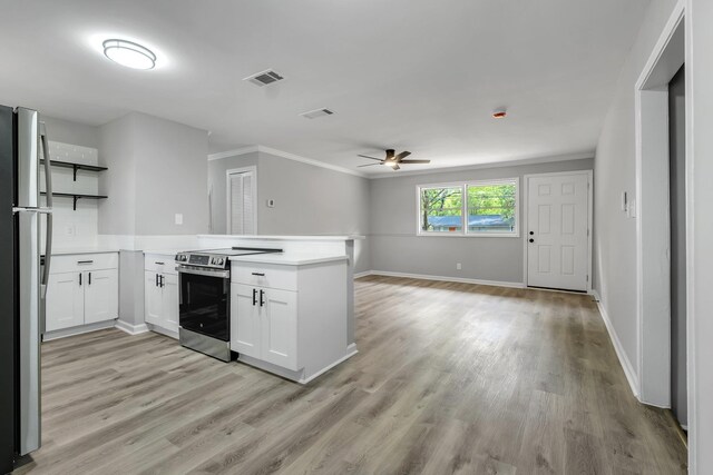 2212 Berkshire Dr, Tallahassee, FL 32304 - kitchen with ceiling fan, a peninsula, open shelves, visible vents, and appliances with stainless steel finishes