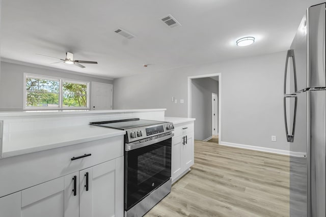 2212 Berkshire Dr, Tallahassee, FL 32304 - kitchen featuring visible vents, ceiling fan, appliances with stainless steel finishes, and light countertops