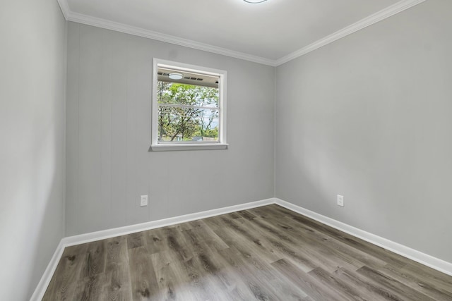 2212 Berkshire Dr, Tallahassee, FL 32304 - spare room with wood finished floors, baseboards, and ornamental molding