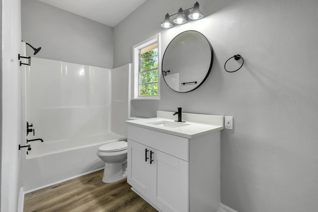 2212 Berkshire Dr, Tallahassee, FL 32304 - bathroom featuring toilet, shower / bathing tub combination, vanity, and wood finished floors