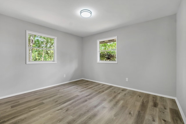 2212 Berkshire Dr, Tallahassee, FL 32304 - spare room with baseboards and wood finished floors