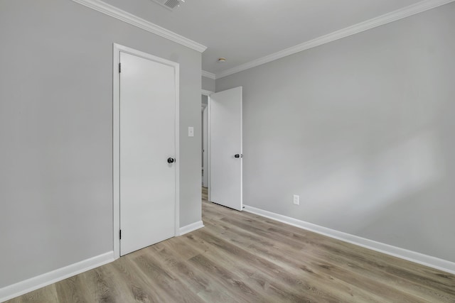 2212 Berkshire Dr, Tallahassee, FL 32304 - unfurnished bedroom featuring light wood-type flooring, baseboards, and ornamental molding