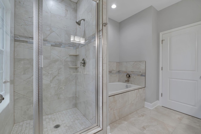 bathroom with shower with separate bathtub