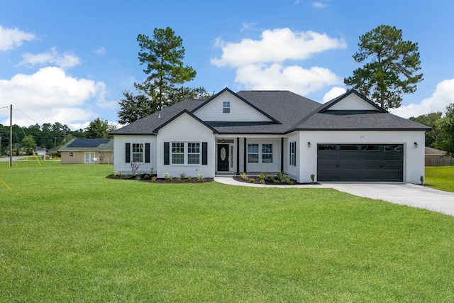 view of front of house with a garage and a front lawn