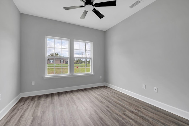 empty room featuring ceiling fan and light wood-type flooring