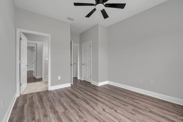 unfurnished bedroom with wood-type flooring and ceiling fan