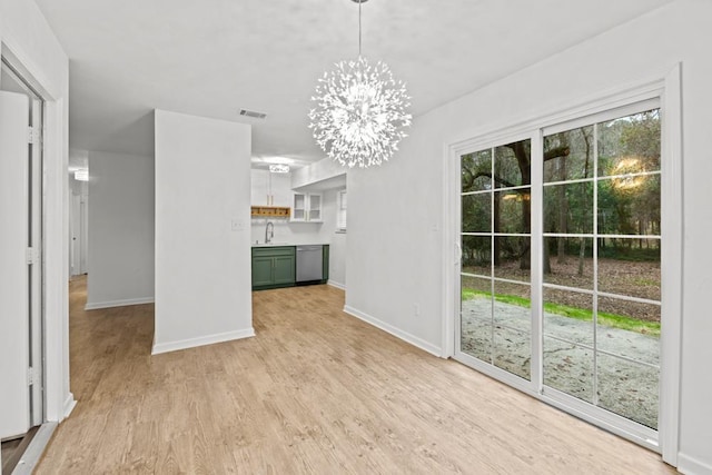 3142 Seattle Slew Ct, Tallahassee, FL 32309 - unfurnished dining area featuring a sink, a chandelier, baseboards, and light wood finished floors