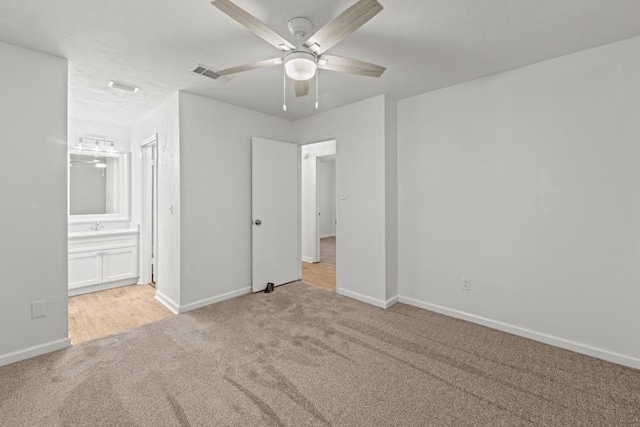 3142 Seattle Slew Ct, Tallahassee, FL 32309 - unfurnished bedroom with carpet, baseboards, ceiling fan, and connected bathroom