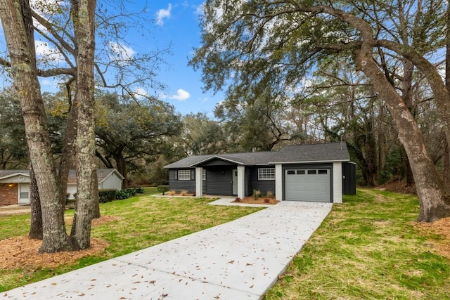 3142 Seattle Slew Ct, Tallahassee, FL 32309 - view of front of house with an attached garage, a front yard, and driveway