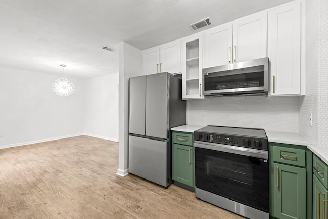 3142 Seattle Slew Ct, Tallahassee, FL 32309 - kitchen with stainless steel appliances, green cabinetry, light countertops, and tasteful backsplash