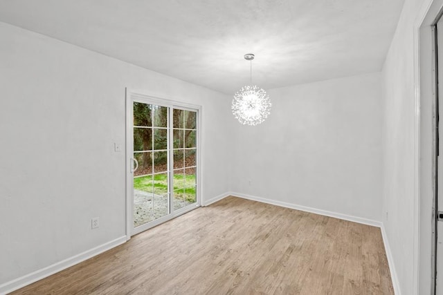 3142 Seattle Slew Ct, Tallahassee, FL 32309 - unfurnished room with light wood-style flooring, a chandelier, and baseboards