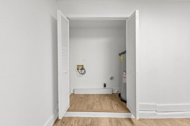 3142 Seattle Slew Ct, Tallahassee, FL 32309 - laundry room with washer hookup, electric water heater, and wood finished floors